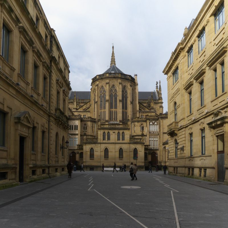 A stately street leading to the apse of the Buen Pastor Cathedral in San Sebastián.